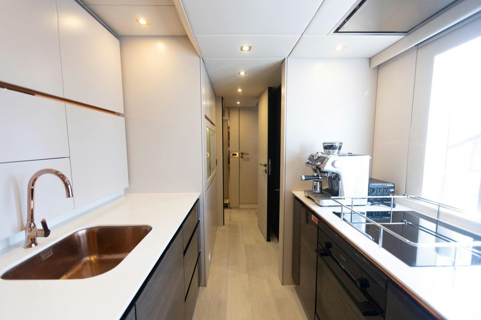 a kitchen with a sink and a large window aboard ROCK STAR 2.0 Yacht for Sale