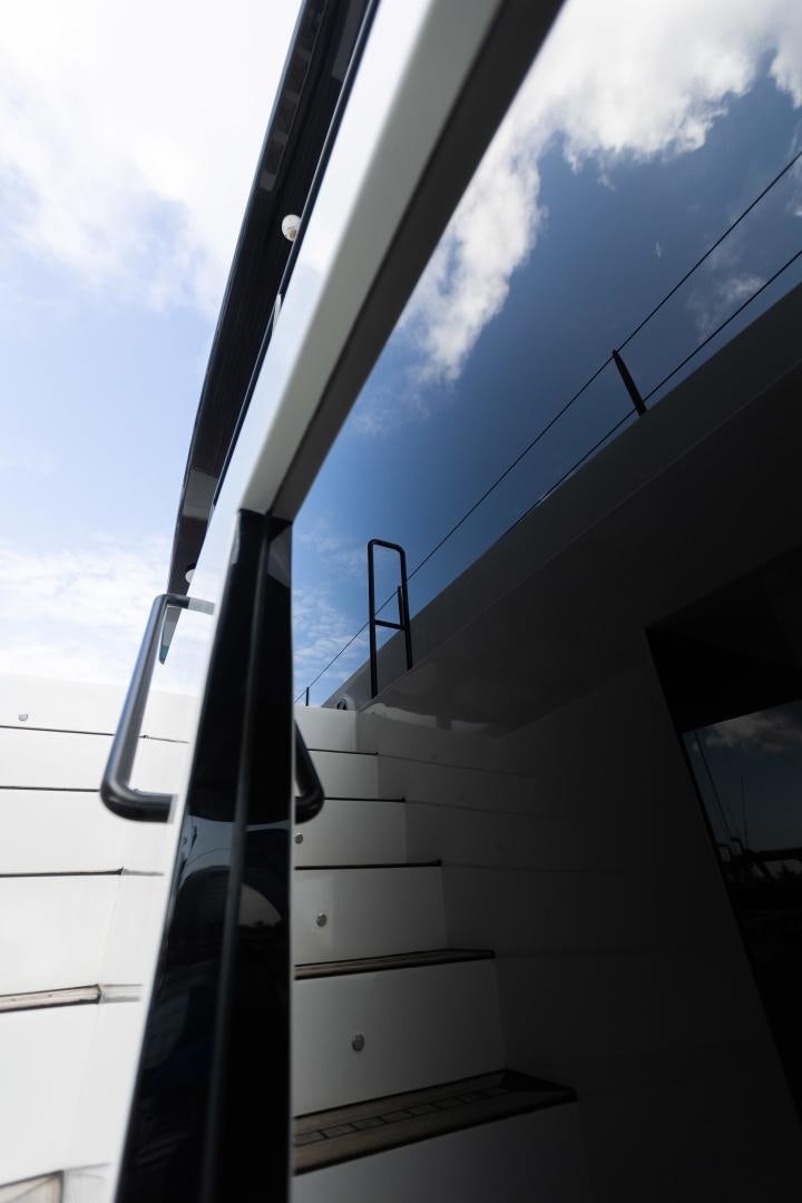 a white staircase with a railing aboard ROCK STAR 2.0 Yacht for Sale