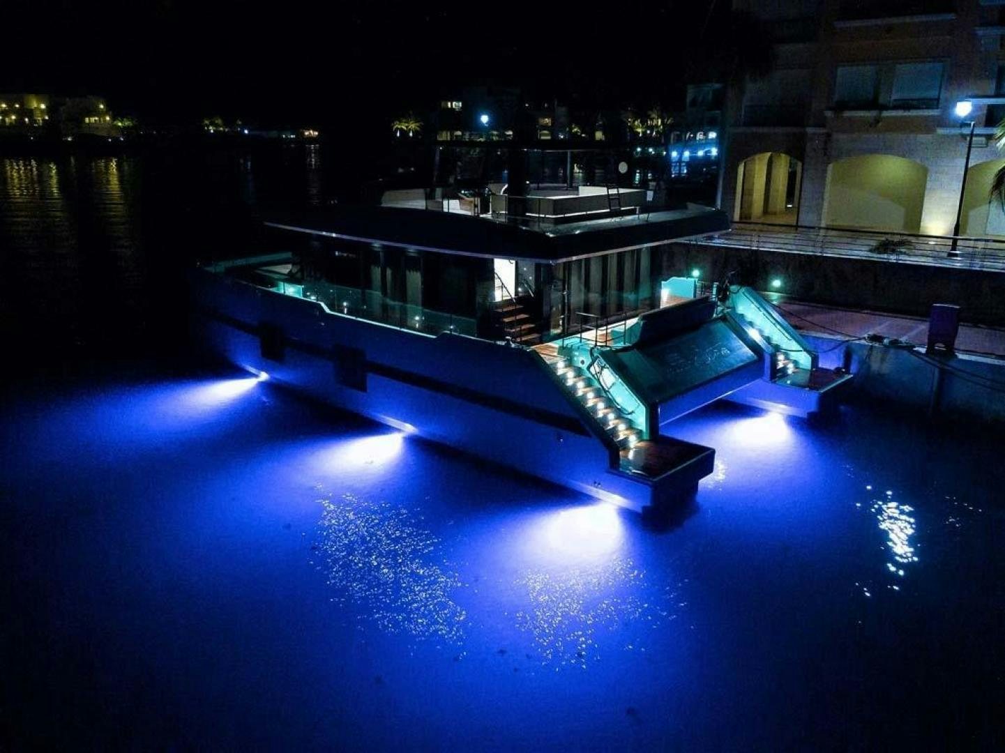 a pool at night aboard ROCK STAR 2.0 Yacht for Sale