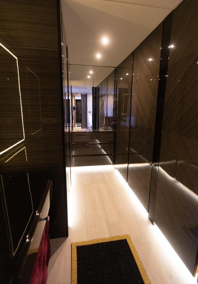 a hallway with glass walls aboard ROCK STAR 2.0 Yacht for Sale