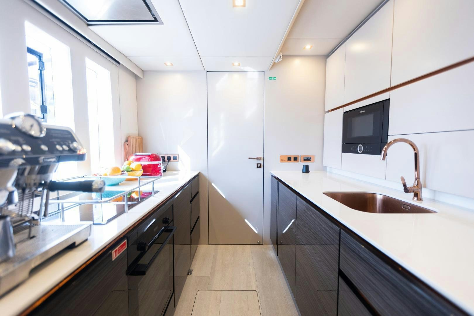a kitchen with a sink and a microwave aboard ROCK STAR 2.0 Yacht for Sale
