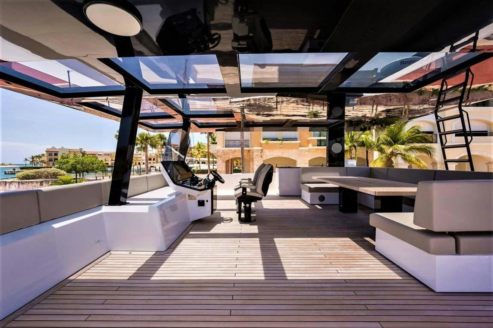 a room with a bench and a chair aboard ROCK STAR 2.0 Yacht for Sale