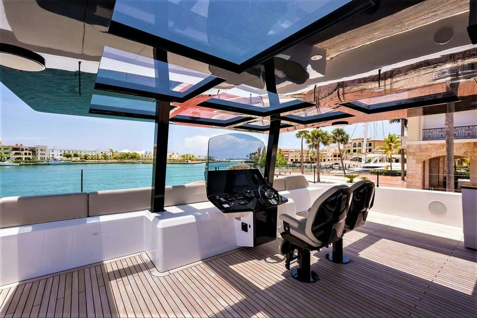 a pool with a table and chairs aboard ROCK STAR 2.0 Yacht for Sale