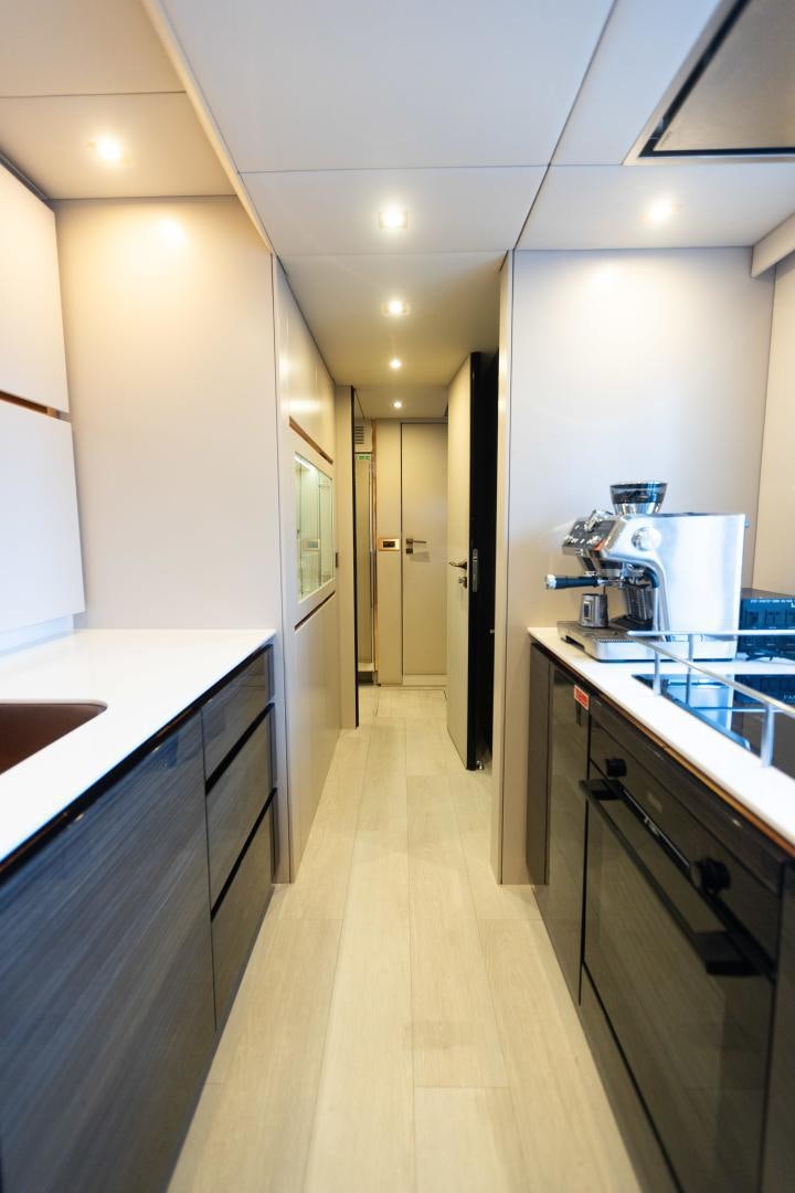 a kitchen with a long counter aboard ROCK STAR 2.0 Yacht for Sale