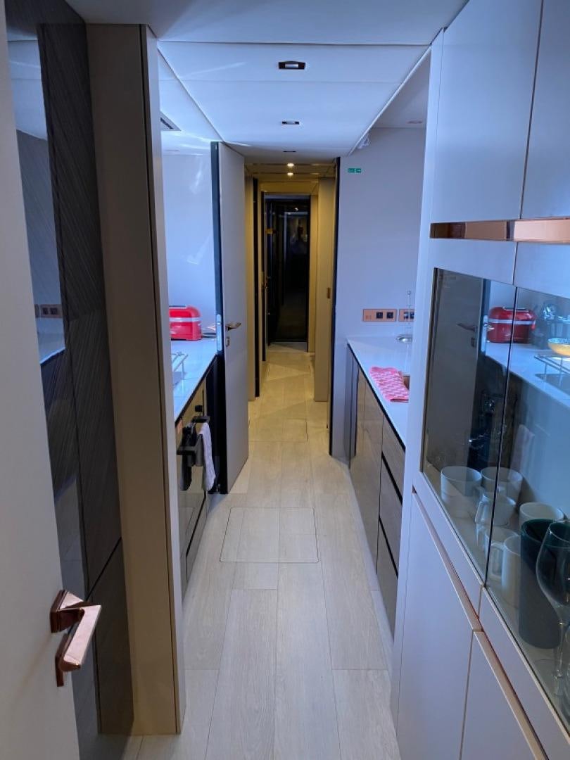 a hallway with a glass door aboard ROCK STAR 2.0 Yacht for Sale