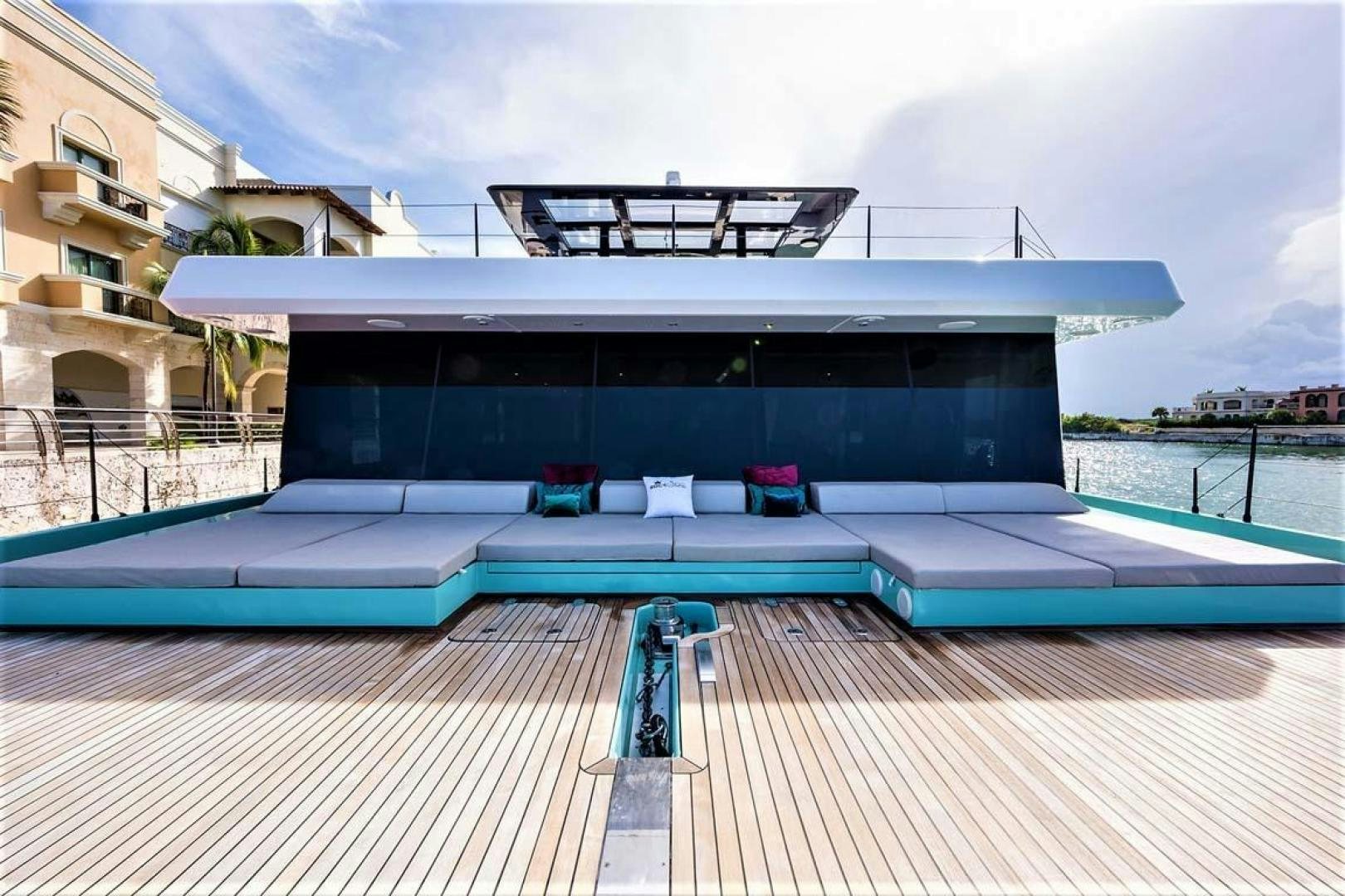 a large blue house with a pool aboard ROCK STAR 2.0 Yacht for Sale