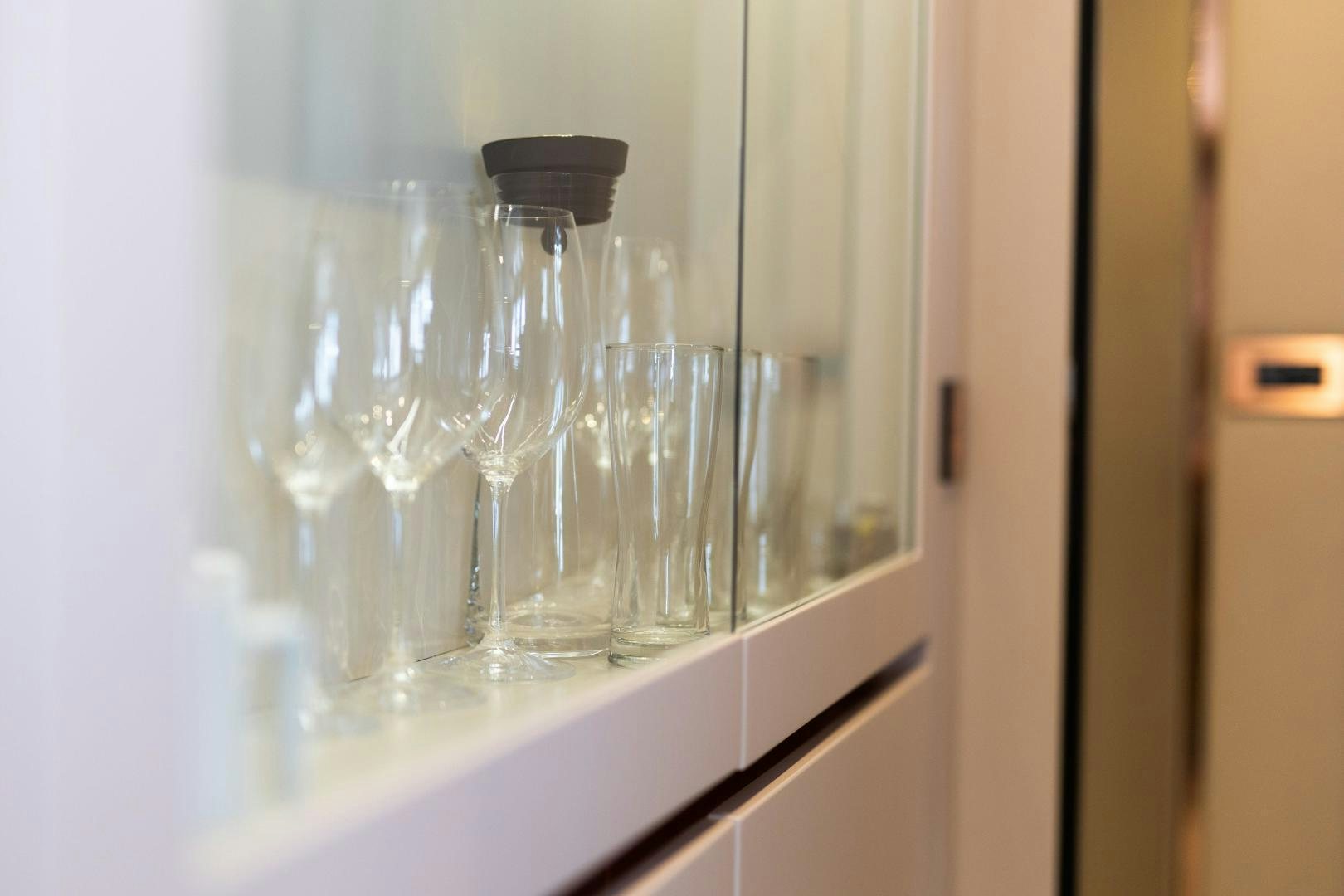 a group of beakers on a shelf aboard ROCK STAR 2.0 Yacht for Sale