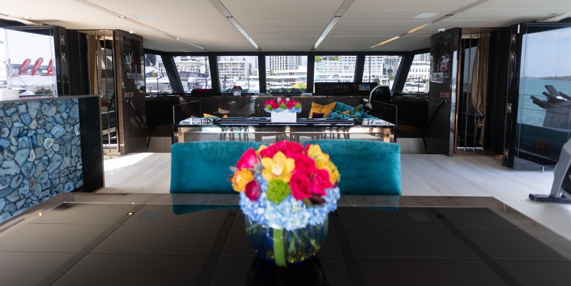 a vase of flowers on a table aboard ROCK STAR 2.0 Yacht for Sale
