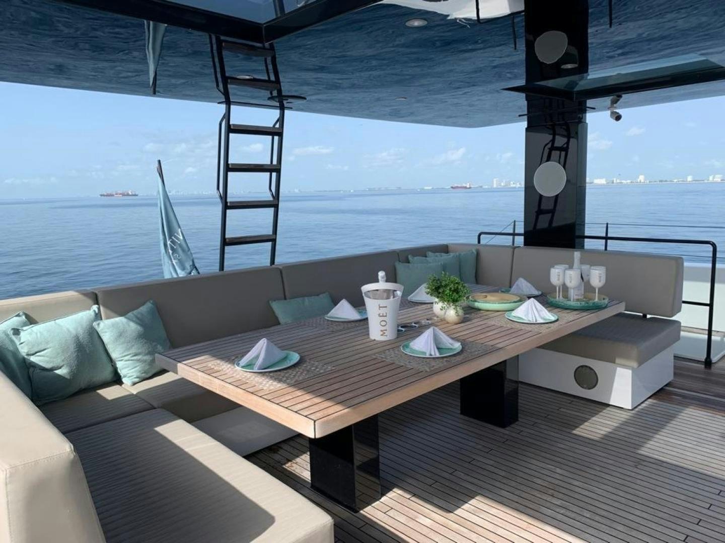a table on a deck aboard ROCK STAR 2.0 Yacht for Sale