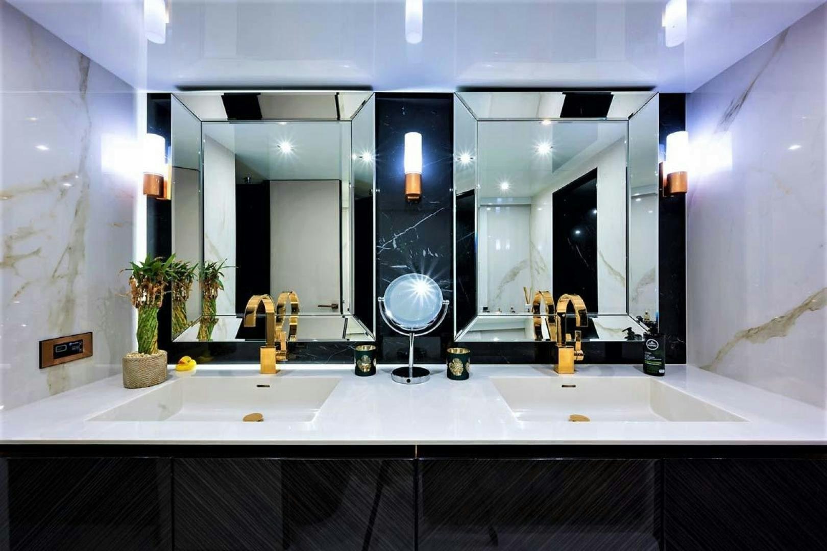 a bathroom with a large mirror aboard ROCK STAR 2.0 Yacht for Sale