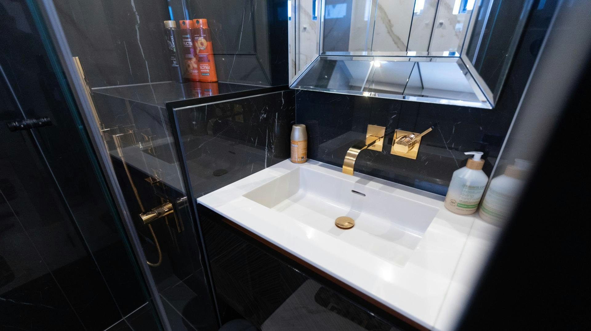 a bathroom with a sink and a mirror aboard ROCK STAR 2.0 Yacht for Sale