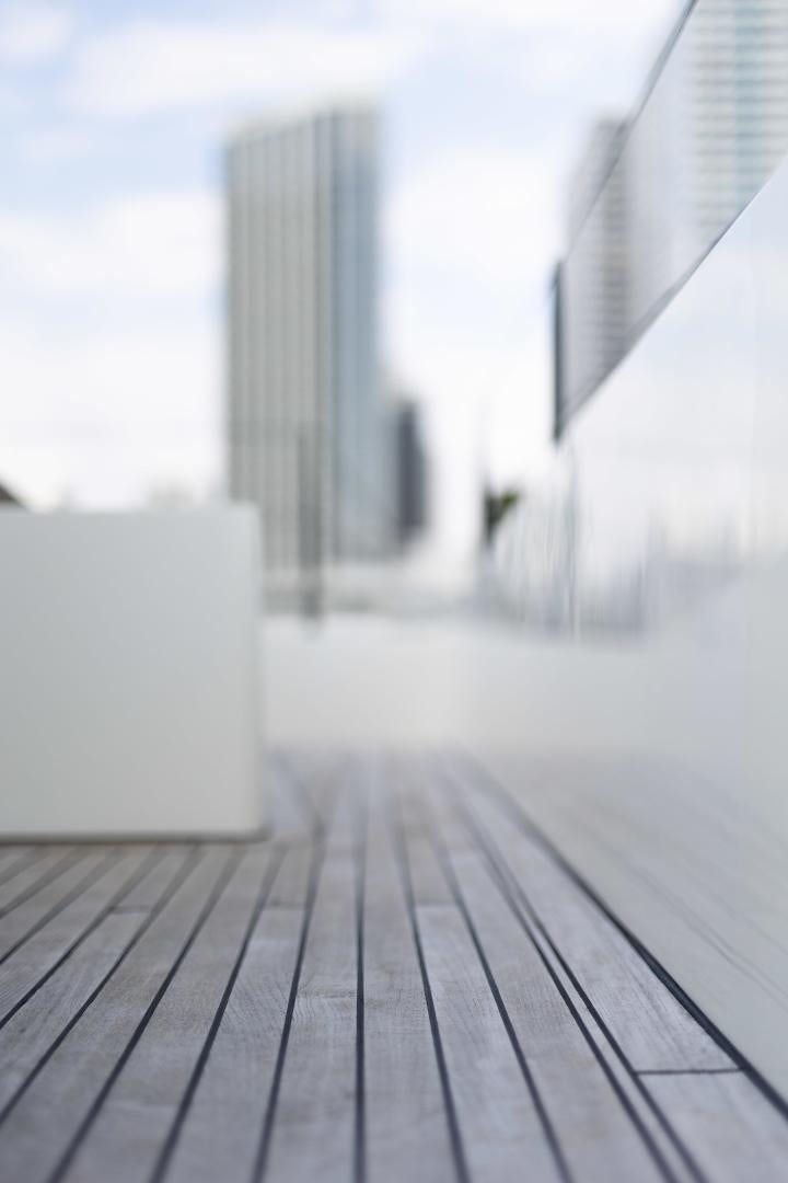 a white couch on a wooden floor aboard ROCK STAR 2.0 Yacht for Sale