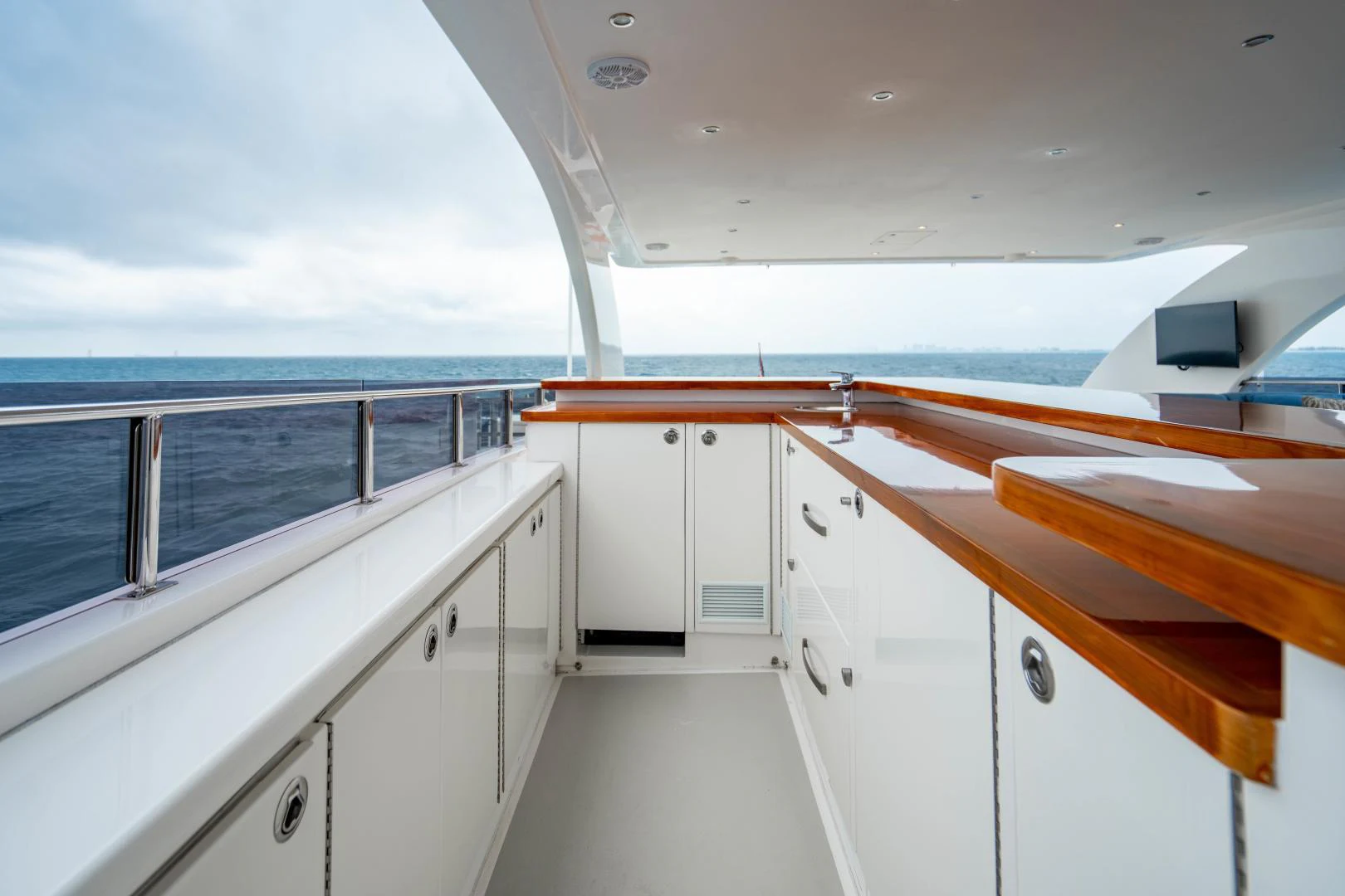 a white kitchen with white cabinets aboard RENAISSANCE Yacht for Sale