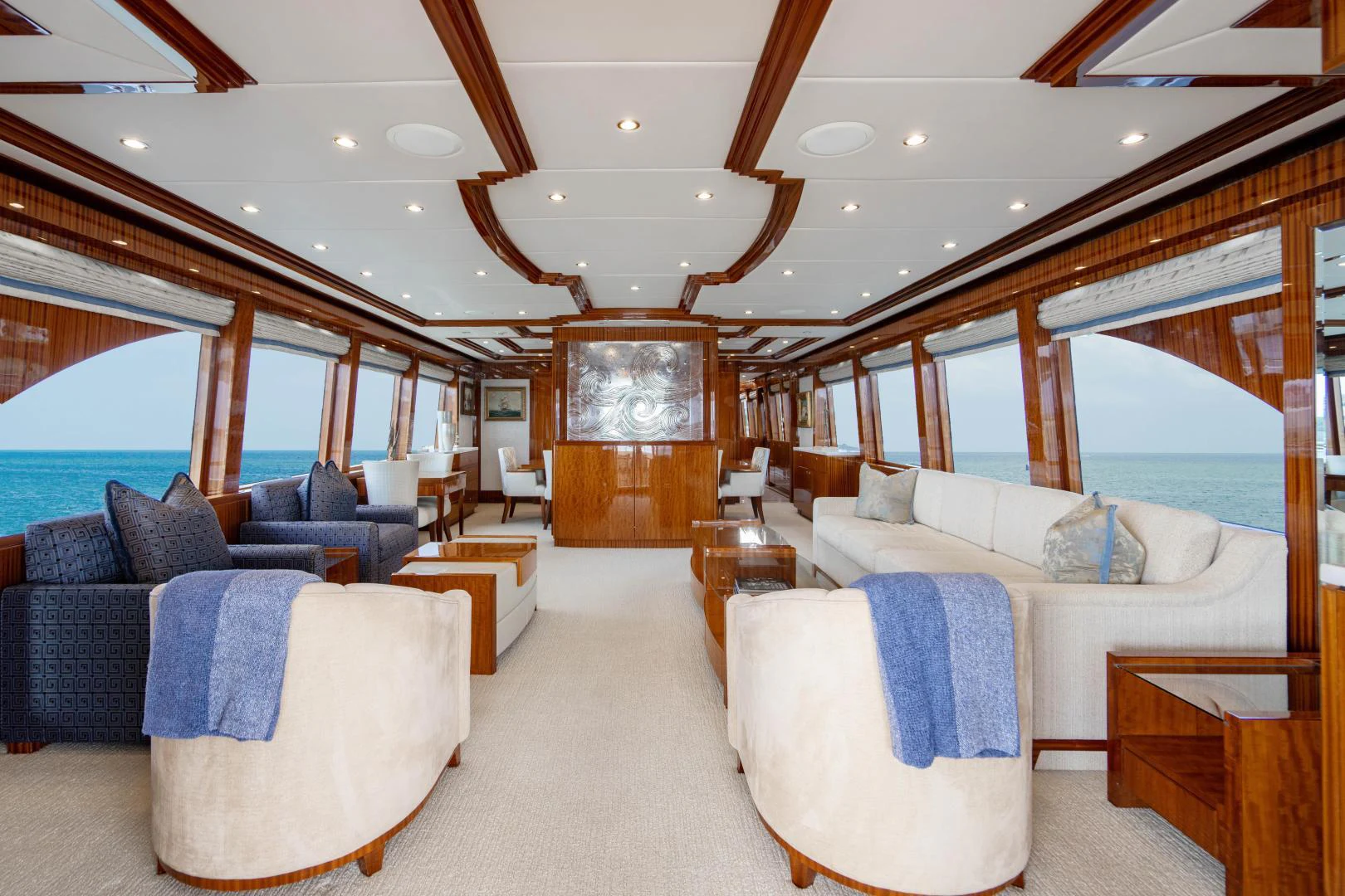 a large room with a bed and a couch aboard RENAISSANCE Yacht for Sale