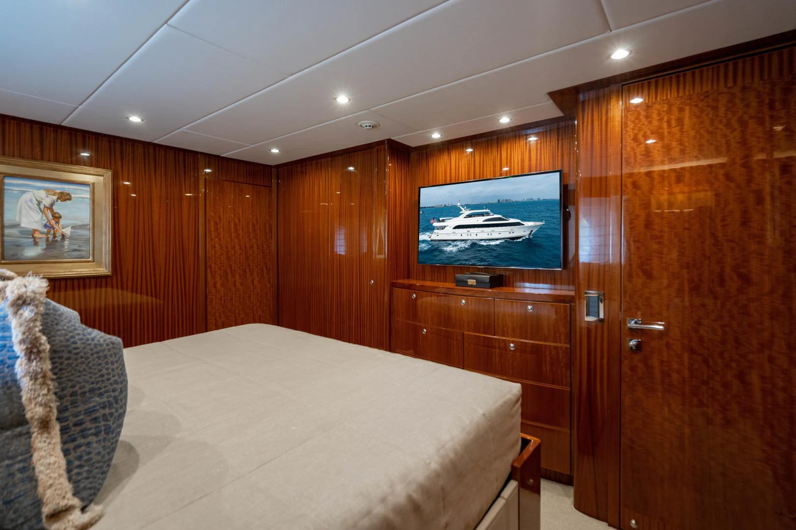 a room with a bed and a television aboard RENAISSANCE Yacht for Sale
