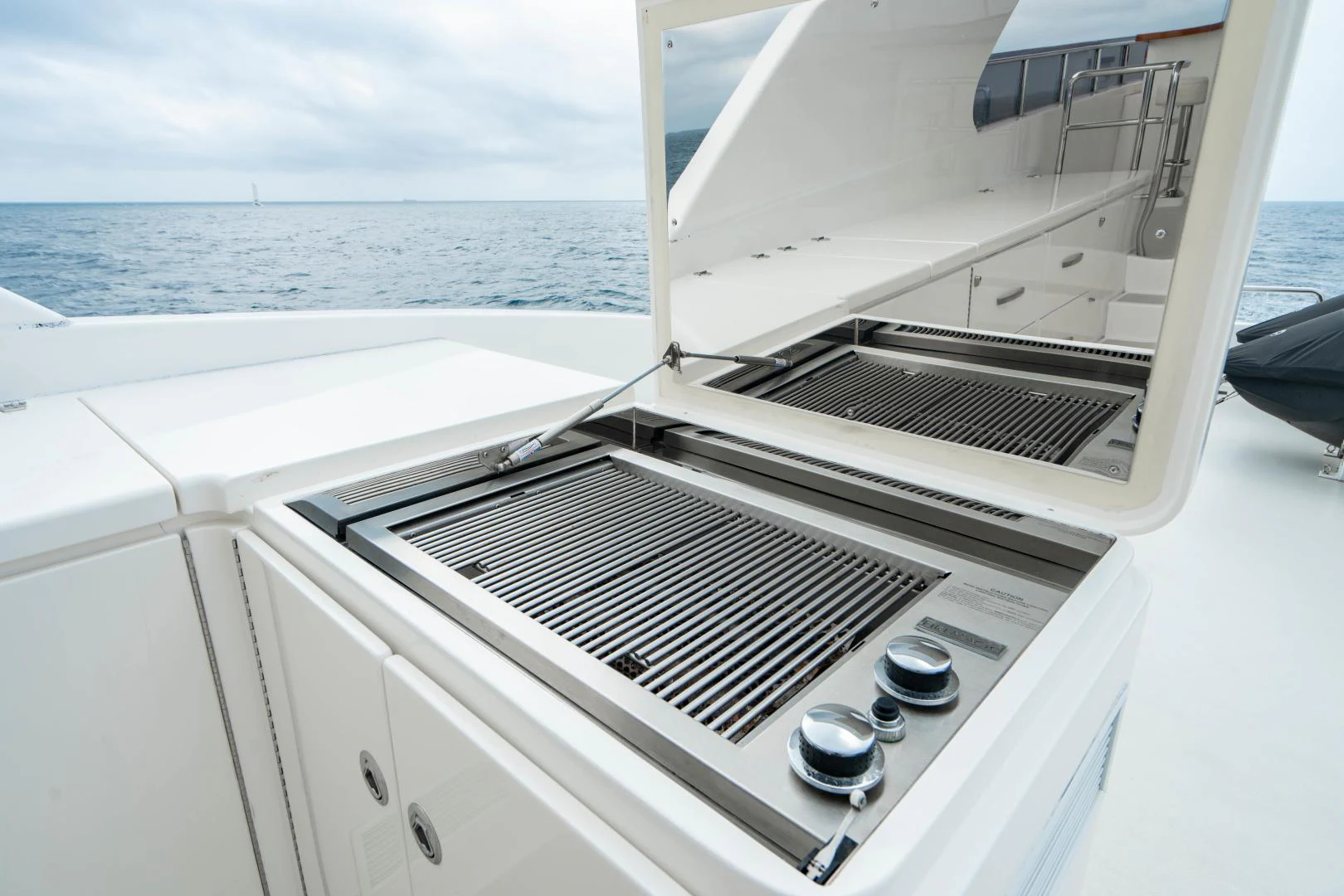 a white boat with a grill aboard RENAISSANCE Yacht for Sale