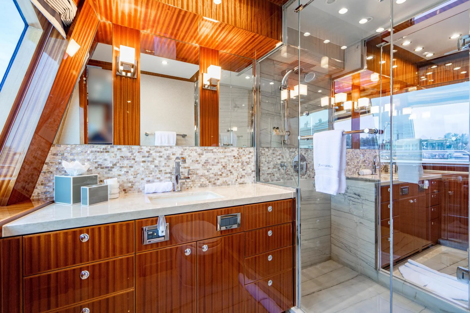 a bathroom with a glass shower aboard RENAISSANCE Yacht for Sale