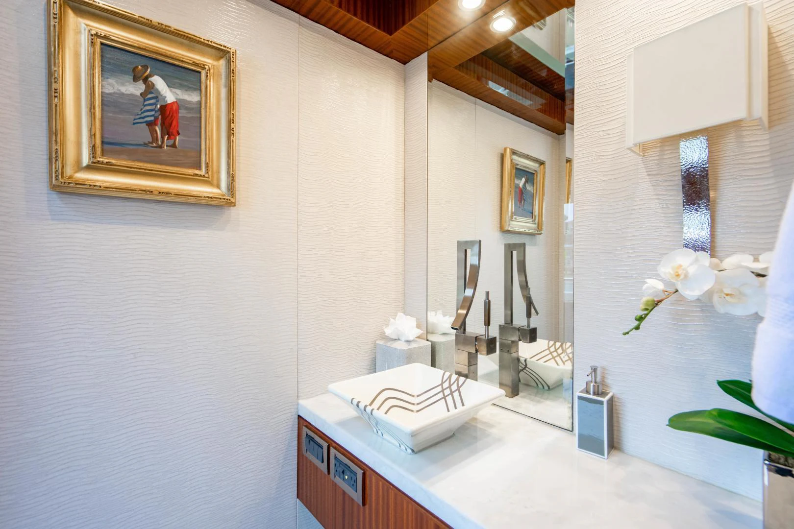 a bathroom with a sink and mirror aboard RENAISSANCE Yacht for Sale