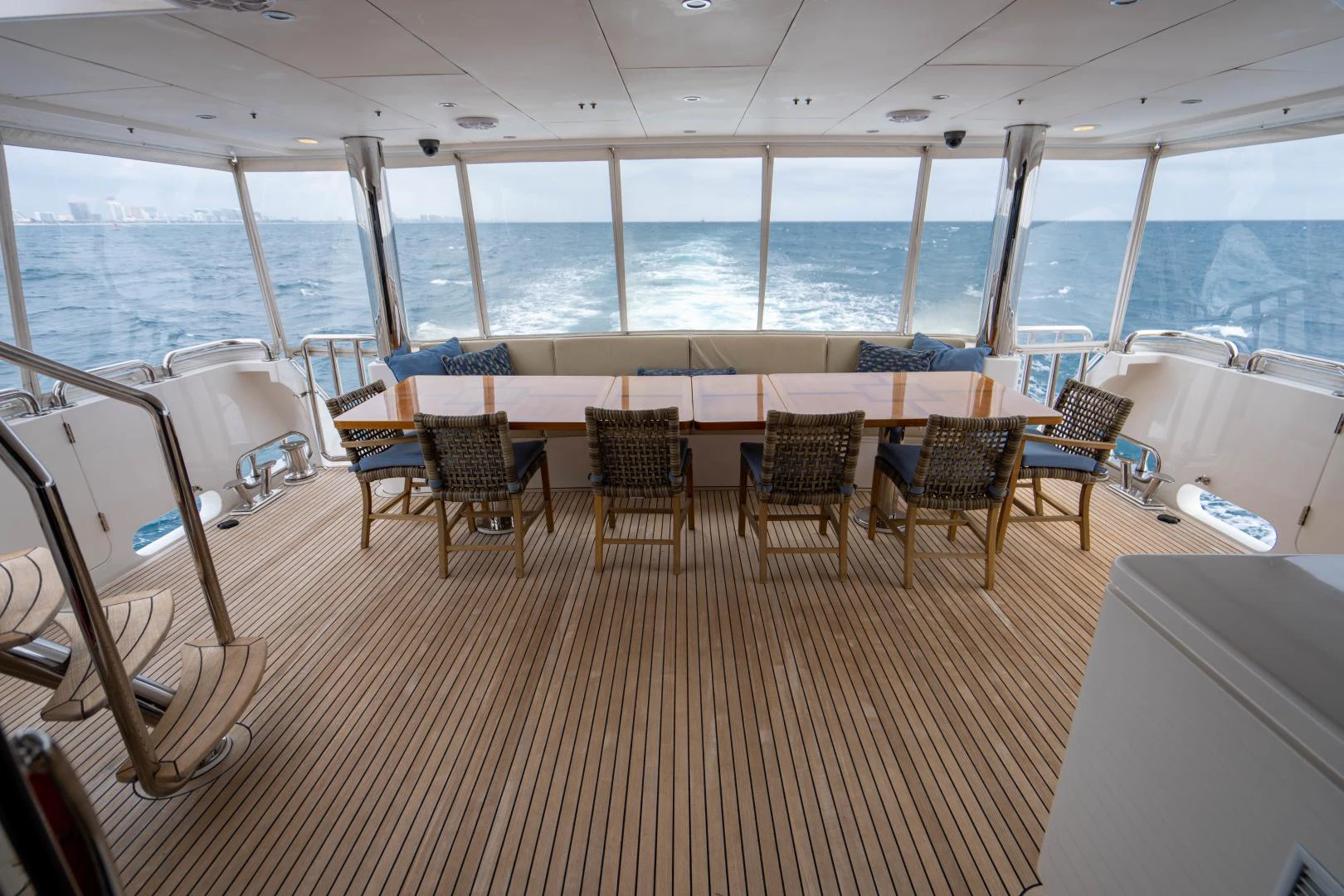 a room with a table chairs and a large window aboard RENAISSANCE Yacht for Sale