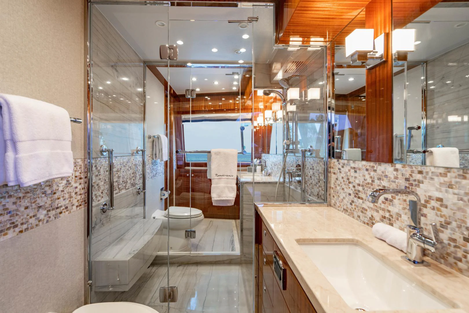 a bathroom with a glass shower aboard RENAISSANCE Yacht for Sale