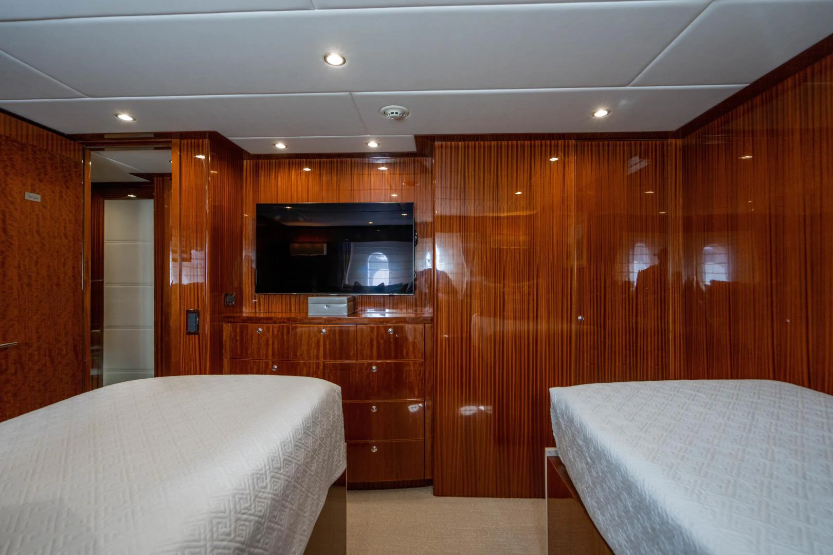 a bed and a television in a room aboard RENAISSANCE Yacht for Sale