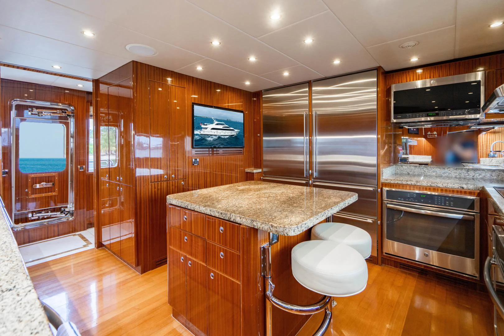 a kitchen with a bar and a bar aboard RENAISSANCE Yacht for Sale