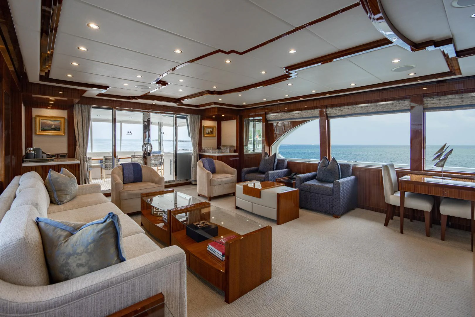 a living room with a large window aboard RENAISSANCE Yacht for Sale