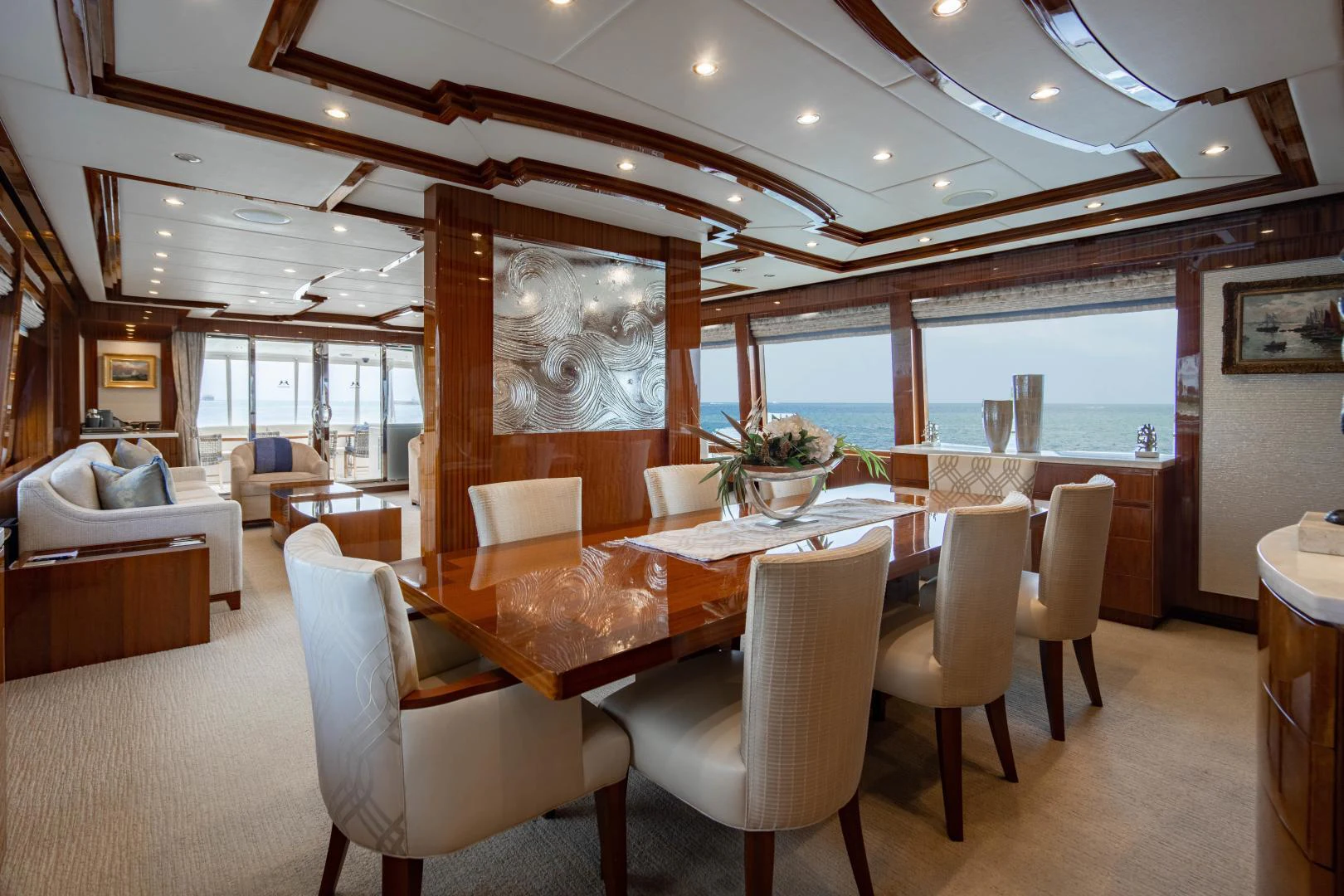 a large room with a table and chairs aboard RENAISSANCE Yacht for Sale