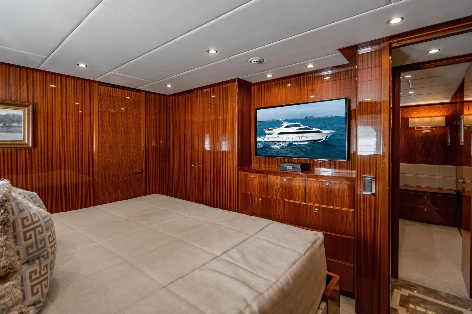 a room with a tv and a bed aboard RENAISSANCE Yacht for Sale