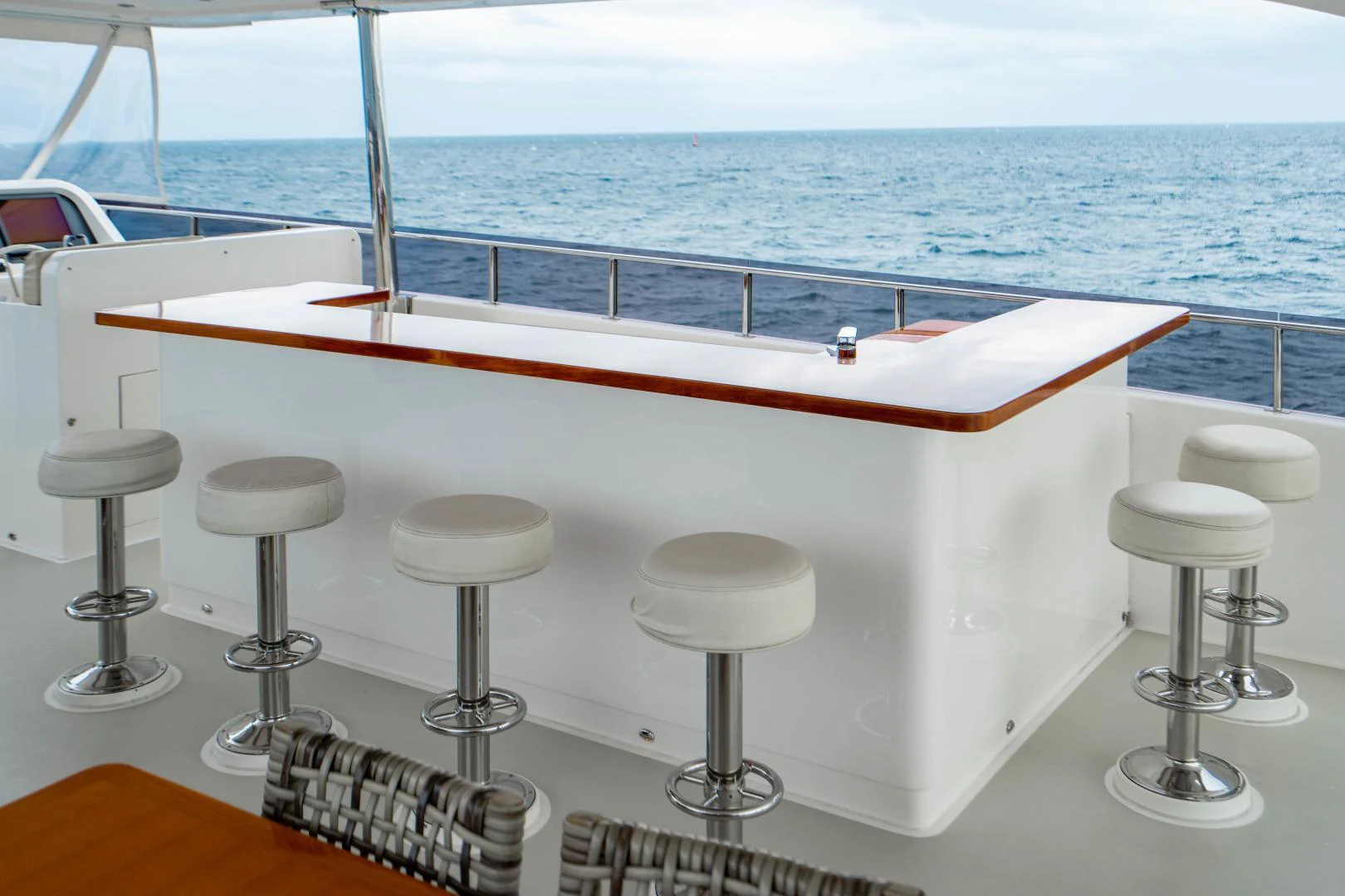 a table with stools on it aboard RENAISSANCE Yacht for Sale