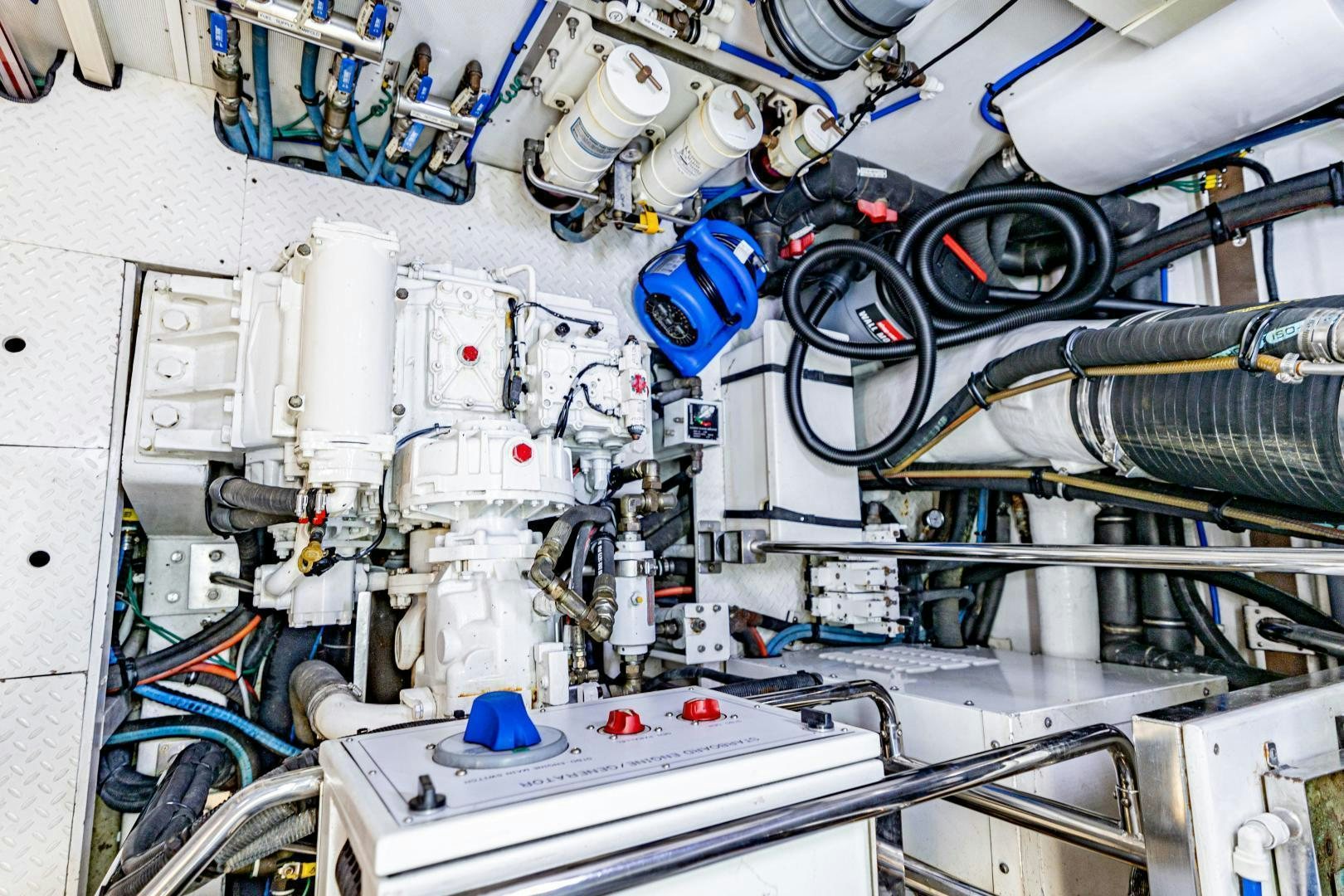 a white machine with blue and red wires aboard GRATITUDE Yacht for Sale