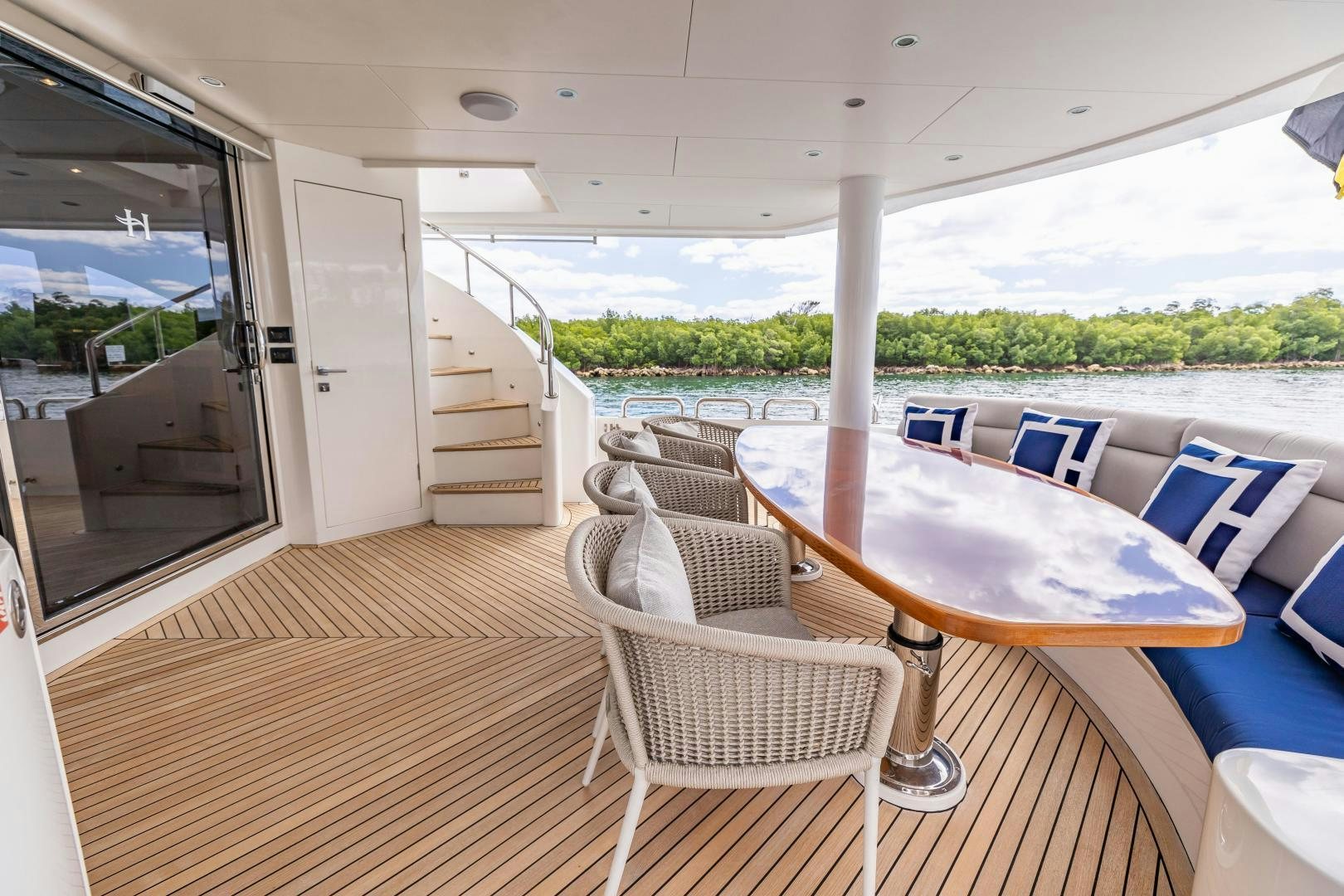a table and chairs on a boat aboard GRATITUDE Yacht for Sale