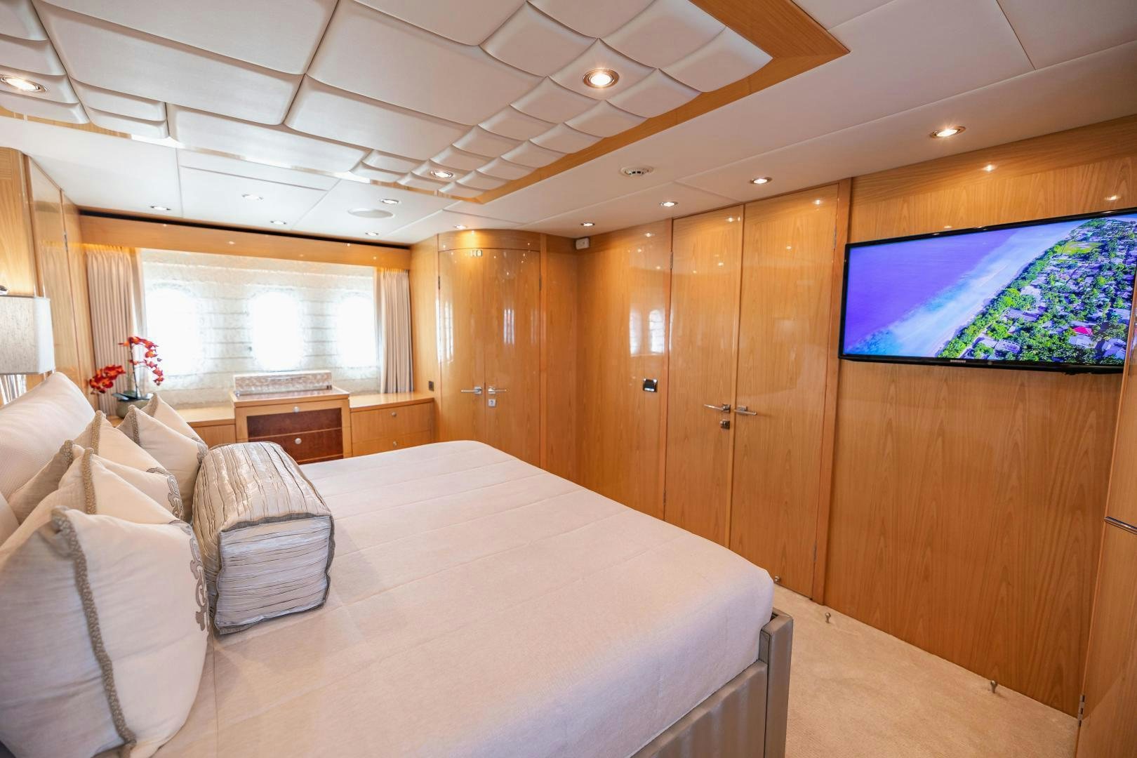 a room with a bed and a tv aboard GRATITUDE Yacht for Sale