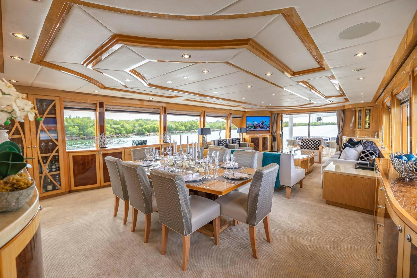 a large dining room with a large open floor plan aboard GRATITUDE Yacht for Sale