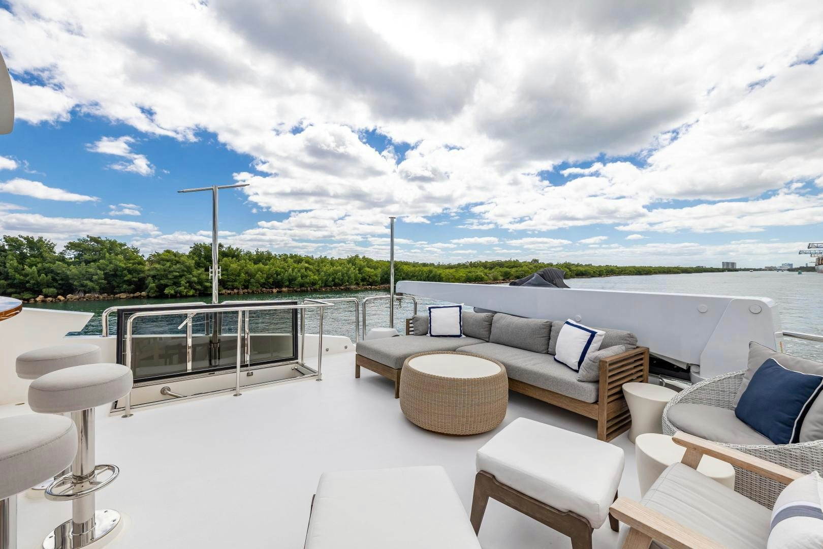 a patio with chairs and a large body of water aboard GRATITUDE Yacht for Sale