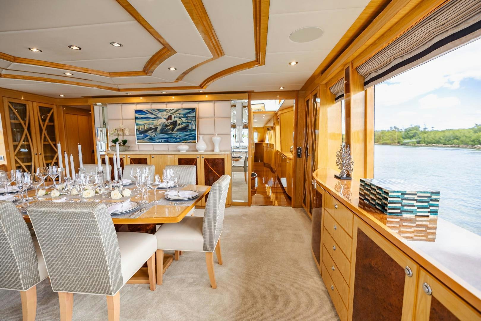 a large kitchen with a dining table aboard GRATITUDE Yacht for Sale