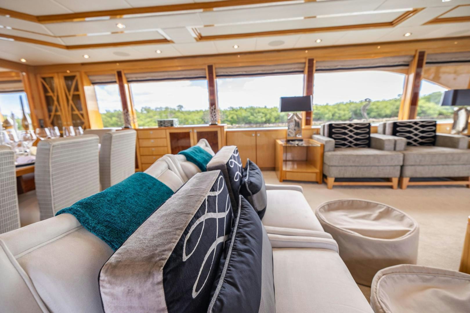 a large living room with a large window aboard GRATITUDE Yacht for Sale