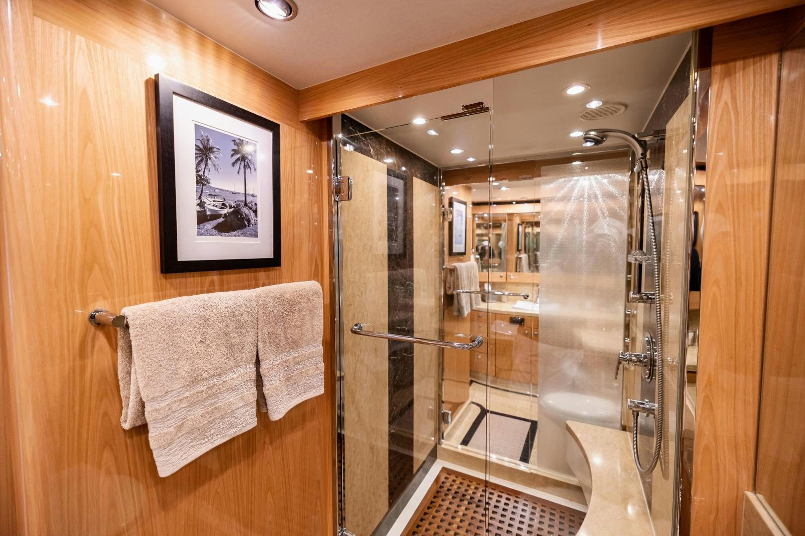 a bathroom with a glass shower aboard GRATITUDE Yacht for Sale