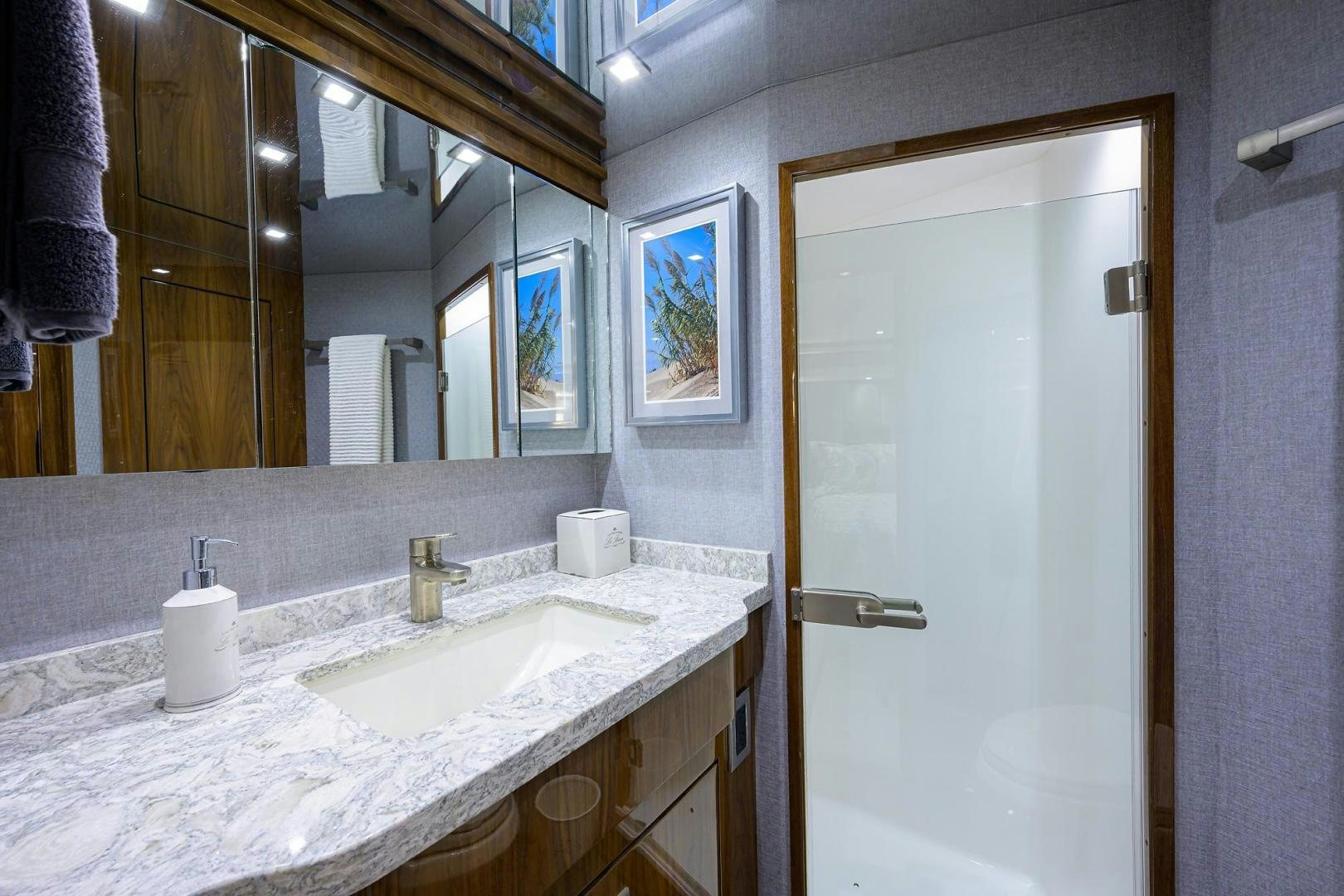 a bathroom with a large mirror aboard QUICK RAISE Yacht for Sale