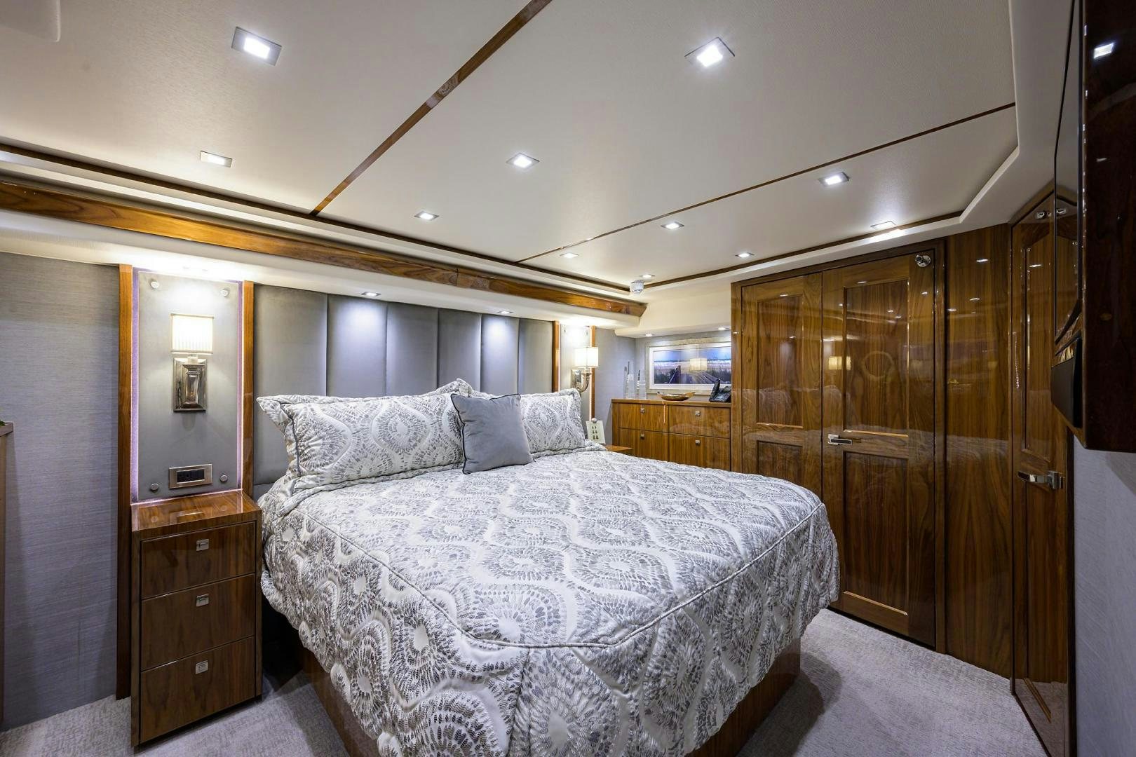 a bedroom with a bed and a closet aboard QUICK RAISE Yacht for Sale