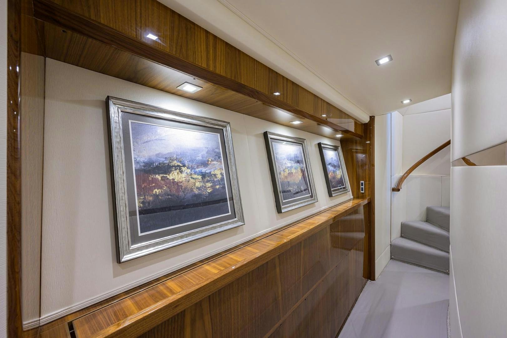 a room with a large painting on the wall aboard QUICK RAISE Yacht for Sale
