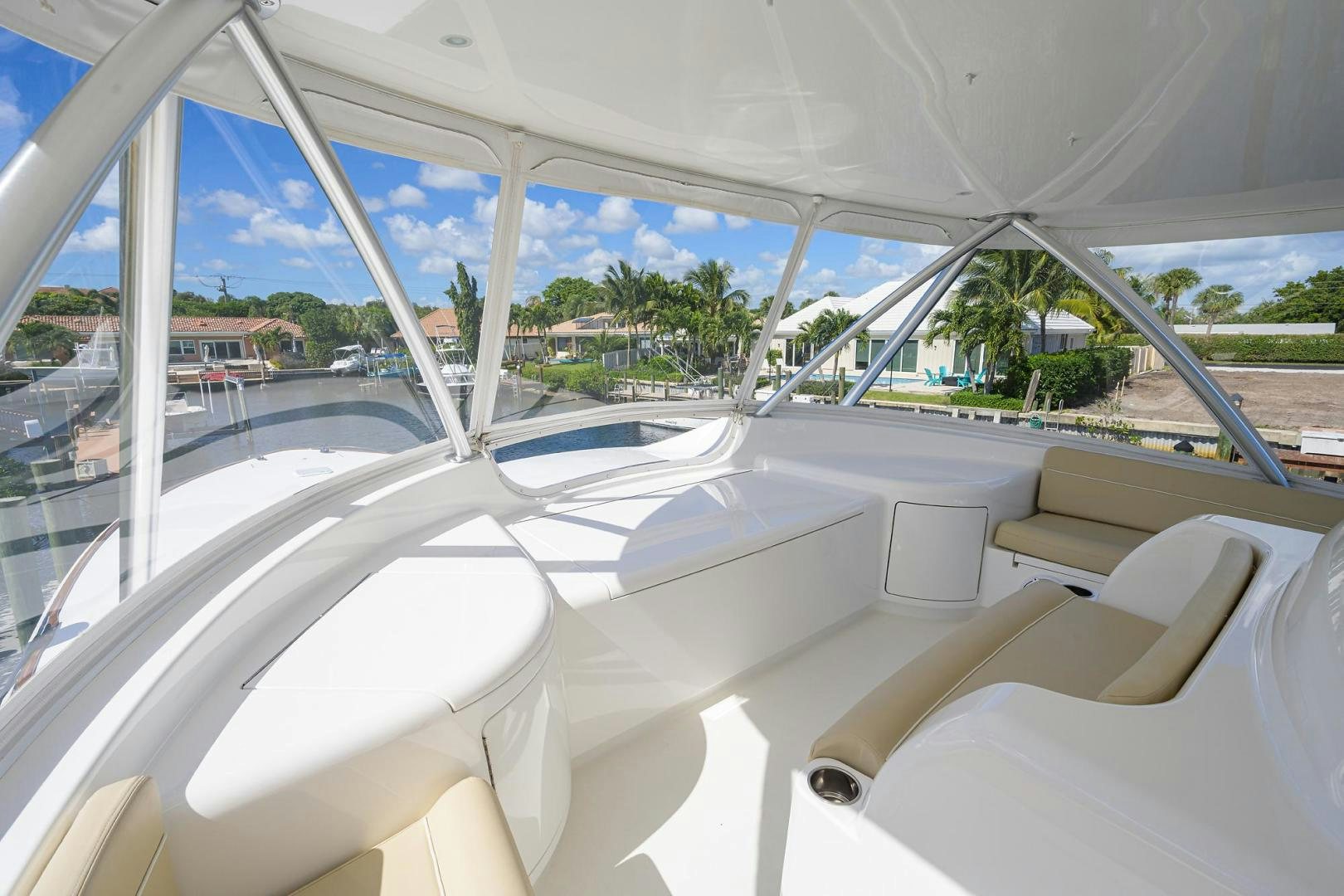 a white boat with a railing and trees and a building in the background aboard QUICK RAISE Yacht for Sale