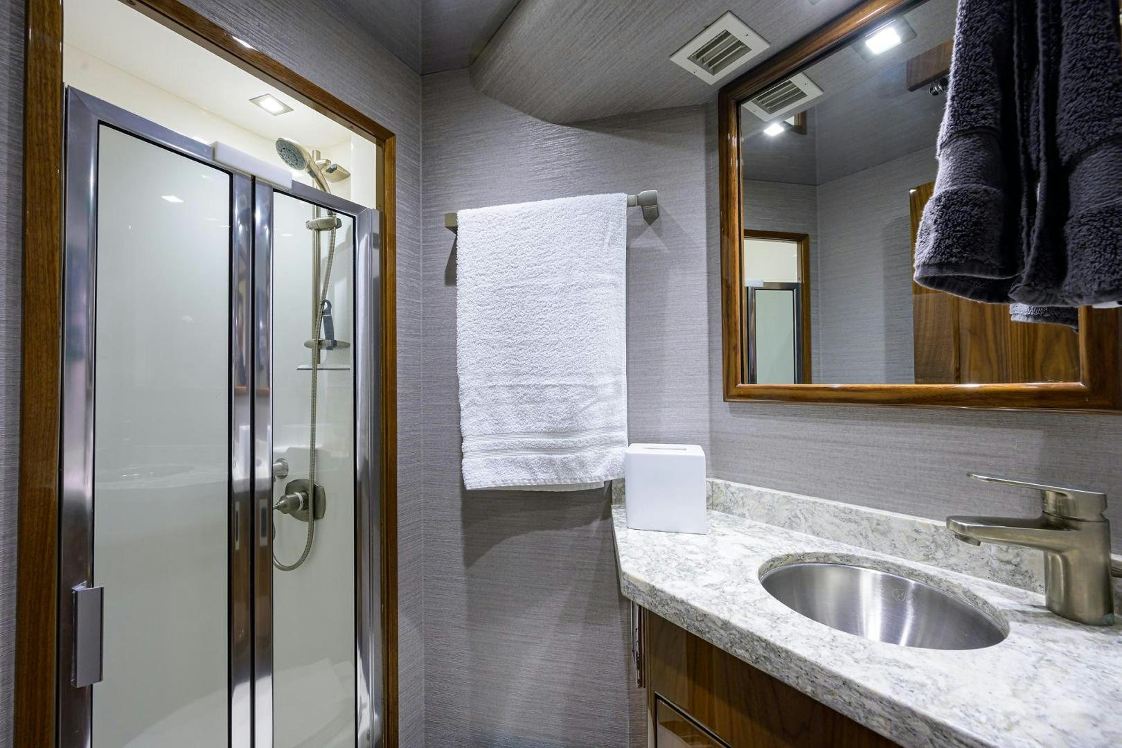 a bathroom with a sink and a mirror aboard QUICK RAISE Yacht for Sale