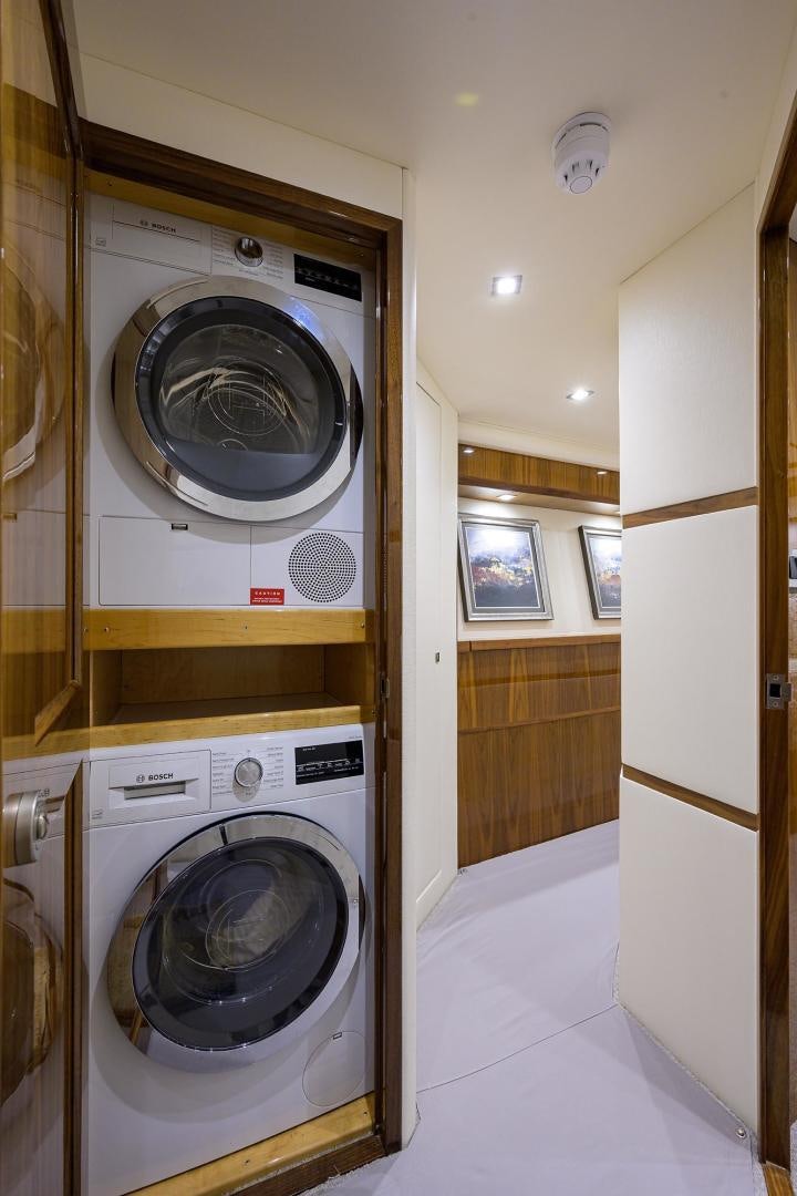a washing machine and dryer in a room aboard QUICK RAISE Yacht for Sale