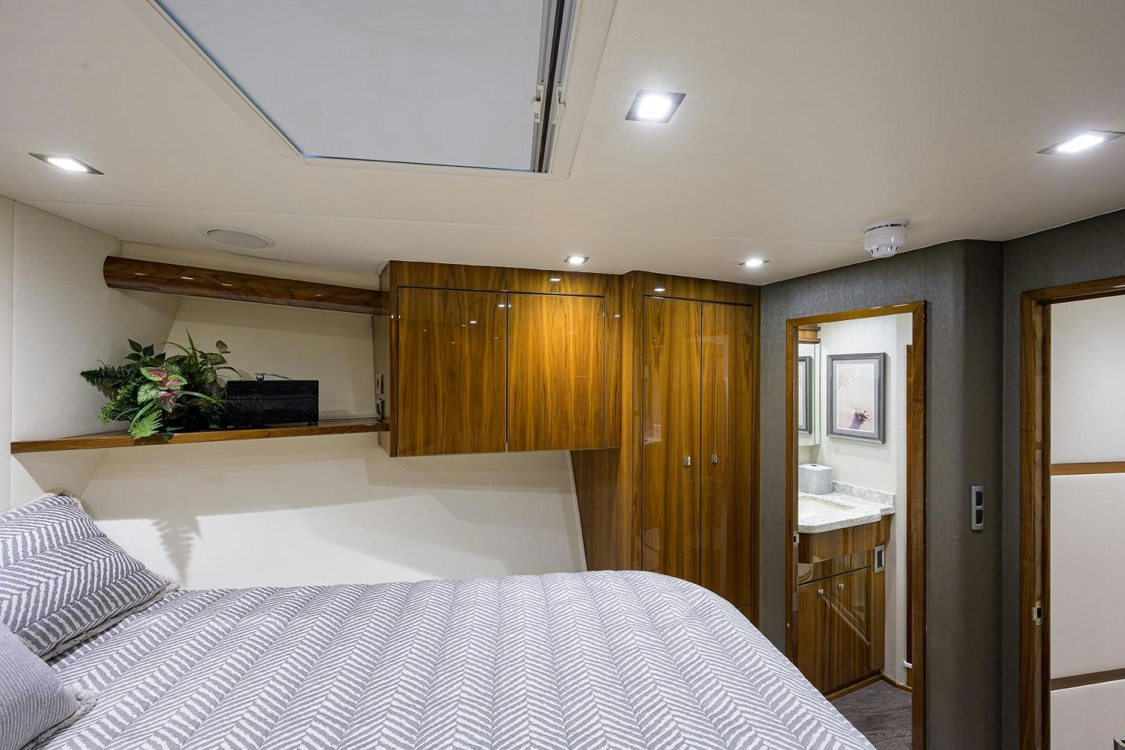 a bedroom with a bed and a desk aboard QUICK RAISE Yacht for Sale