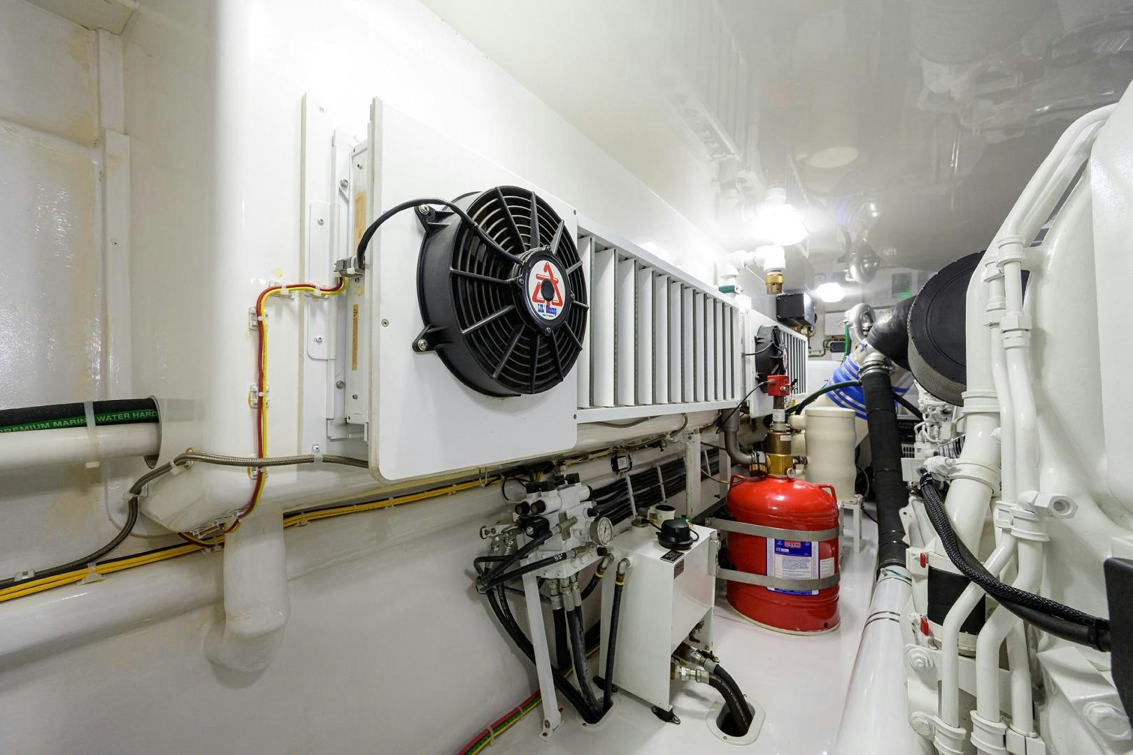 a white machine with a black circle on the back aboard QUICK RAISE Yacht for Sale