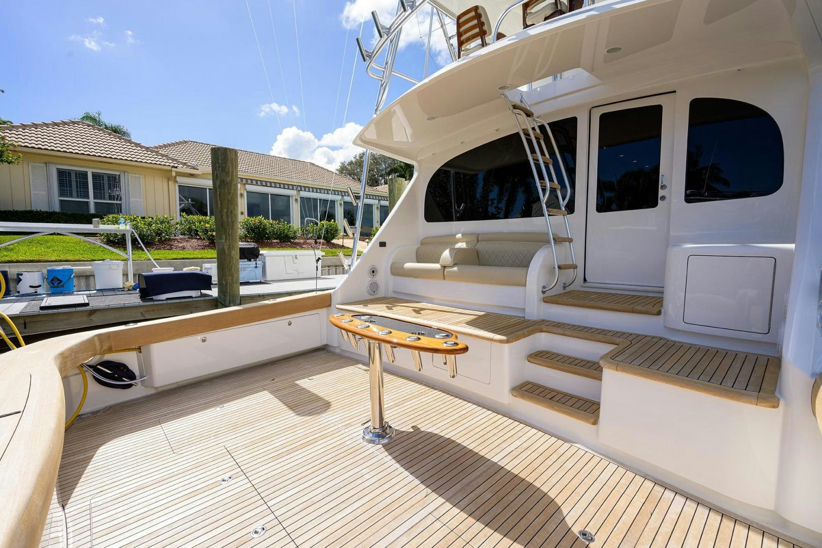 a deck with a table and chairs aboard QUICK RAISE Yacht for Sale