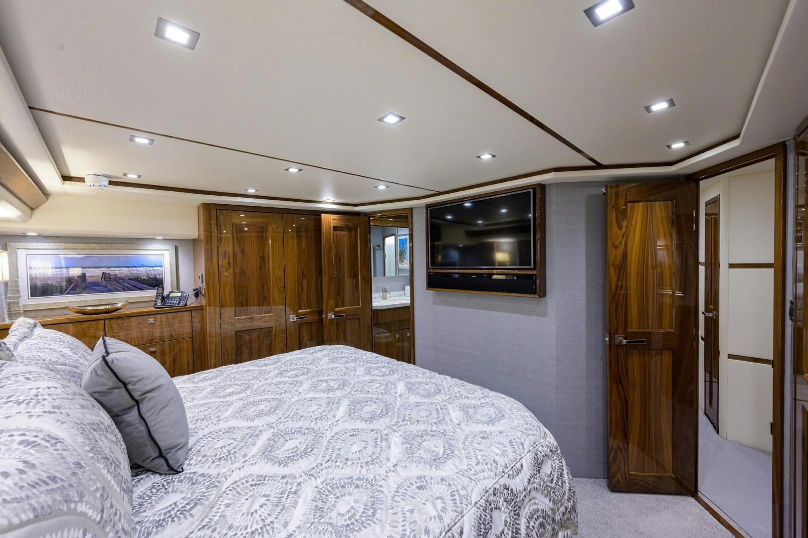 a bedroom with a bed and television aboard QUICK RAISE Yacht for Sale