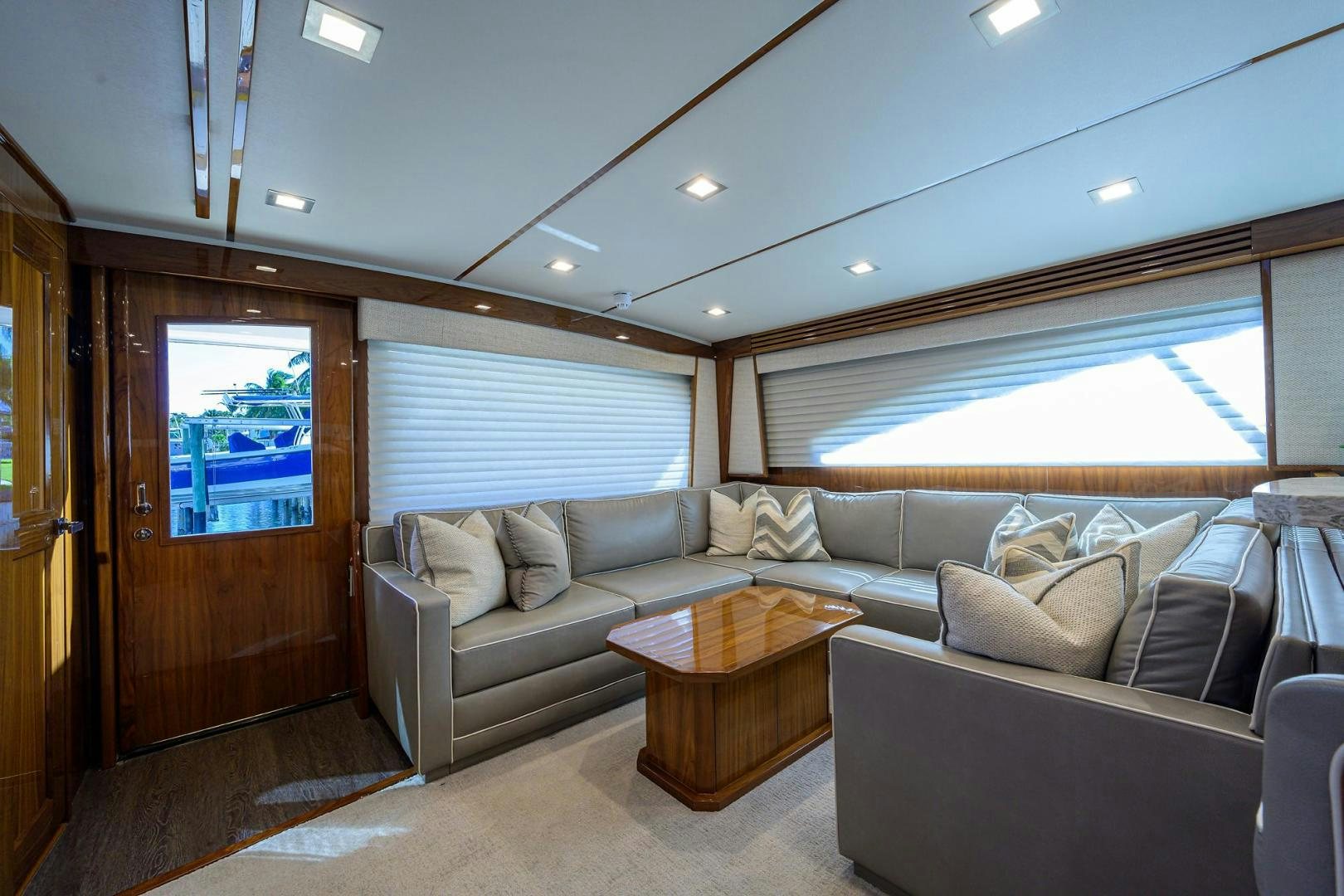 a living room with a couch and a coffee table aboard QUICK RAISE Yacht for Sale
