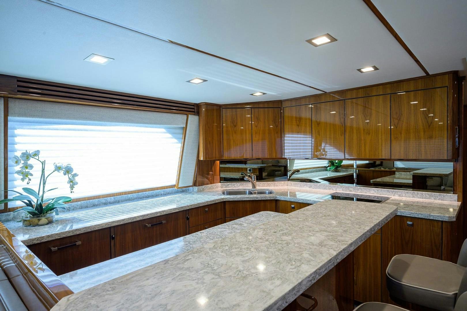 a kitchen with wooden cabinets aboard QUICK RAISE Yacht for Sale